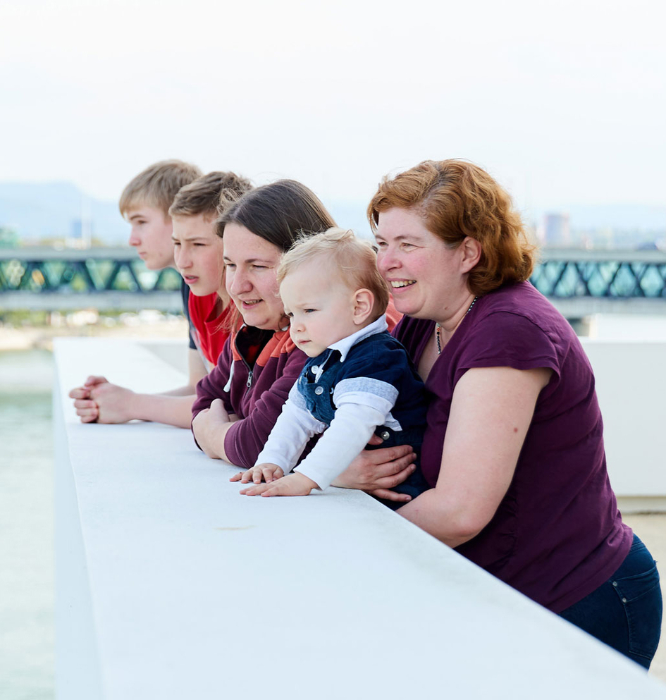 Family smiling at the sea