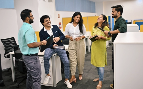A group of associates having fun at work