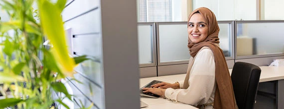 A female Novartis associate in an office