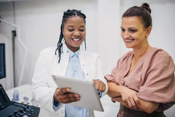 Doctor and patient interacting on medical results