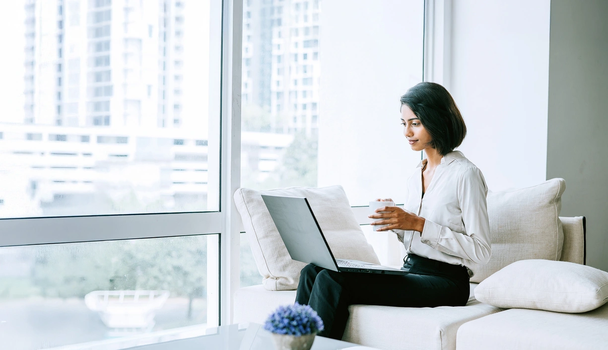 Business woman working on her laptop in a bright atmosphere