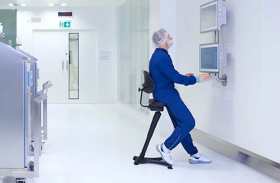 Production specialist working on a computer