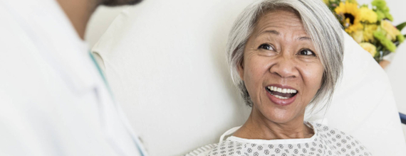 Woman smiling at doctor